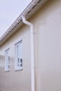 White plastic rain guttering system. Guttering drainage pipe exterior. Royalty Free Stock Photo