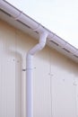 White plastic rain guttering system. Guttering drainage pipe exterior. Royalty Free Stock Photo