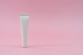 White plastic tube on pink background. ÃÂ¡osmetic bottles for beauty or medicine products Royalty Free Stock Photo