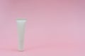 White plastic tube on pink background. ÃÂ¡osmetic bottles for beauty or medicine products Royalty Free Stock Photo