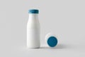 White plastic yogurt or milk bottle mockup with blank label Royalty Free Stock Photo