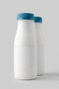 White plastic yogurt or milk bottle mockup with blank label Royalty Free Stock Photo