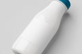 White plastic yogurt or milk bottle mockup with blank label. Closeup Royalty Free Stock Photo