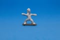 A white plasticine doll practicing skateboarding