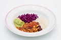 White plate of chili sin carne with red cabbage, guacamole and r Royalty Free Stock Photo