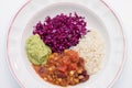 White plate of chili sin carne with red cabbage, guacamole and r Royalty Free Stock Photo