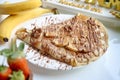 White Plate With Chocolate-covered Banana Split Royalty Free Stock Photo