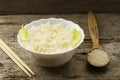 White plate of cooked long-grain rice on wooden background. Healthy eating, diet Royalty Free Stock Photo