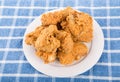 White Plate of Crispy Fried Chicken on Blue Towel Royalty Free Stock Photo