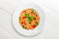 Delicious pasta on white plate on background