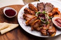 White plate with different types of meat prepared on the grill by special Turkish recipe. Royalty Free Stock Photo