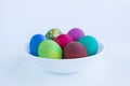 White plate of Easter versicolored boiled eggs decoration isolated