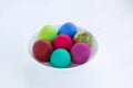 White plate of Easter versicolored boiled eggs decoration