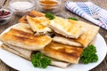 White plate with envelopes of thin Armenian bread lavash fried