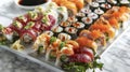 A white plate filled with an assortment of fresh sushi rolls, sashimi, and nigiri, beautifully presented and ready to be Royalty Free Stock Photo