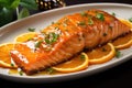 A white plate filled with freshly sliced oranges and tender, juicy salmon, Zesty citrus salmon, featuring a perfectly cooked