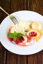 White plate with fruit damplings and whole berries Royalty Free Stock Photo