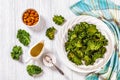 White plate with kale chips on the table Royalty Free Stock Photo