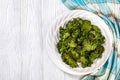 White plate with kale chips on the table Royalty Free Stock Photo