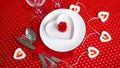 A white plate with a knife and fork on a bright red background Royalty Free Stock Photo