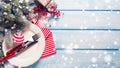 White plate, knife and fork, napkin and christmas decorations in