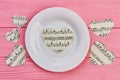 White plate and paper hearts with music notes. Royalty Free Stock Photo