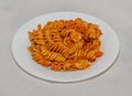 White plate with pasta spaghetti with red tomato sauce,  arrabiata with mushrooms, bacon, parmezan Royalty Free Stock Photo