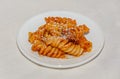 White plate with pasta spaghetti with red tomato sauce,  arrabiata with mushrooms, bacon, parmezan Royalty Free Stock Photo