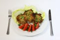 Grilled pork chops with tomatoes and lettuce