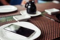 Soy sauce in a white cup on an old dark wooden background with chopsticks sushi and rolls Royalty Free Stock Photo