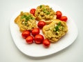 White plate served with salata de vinete and cherry tomatoes