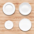 White plate set on wooden background. Kitchen Royalty Free Stock Photo