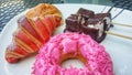 a white plate topped with donuts and pastries