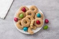 White plate with traditional Greek Easter cookies Koulourakya or Koulourya shortbread rings with sesame seeds, decorated