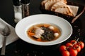 White plate with vegetable soup, meat slices and quail eggs Royalty Free Stock Photo
