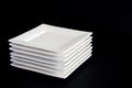 White Plates on Black Royalty Free Stock Photo