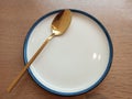 white plates with blue plates combined with gold-toned spoons Royalty Free Stock Photo