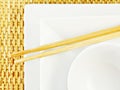 White Plates and Chopsticks on Bamboo Royalty Free Stock Photo