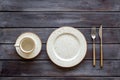 White plates and cup for table setting on wooden background top view mockup Royalty Free Stock Photo