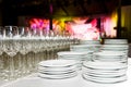 White plates and stemware glass at