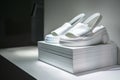 white platform sandals spotlighted on a clean, modern shelf