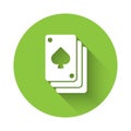 White Playing cards icon isolated with long shadow. Casino gambling. Green circle button. Vector