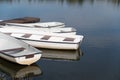 White pleasure boats at the pier on the pond Royalty Free Stock Photo