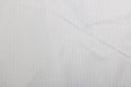 White pleated fabric closeup, texture or background Royalty Free Stock Photo