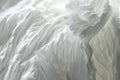 White pleated, flowing background, texture backdrop. Minimalism, fabric structure closeup Royalty Free Stock Photo
