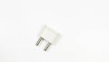A white plug with two prongs sits on a white background Royalty Free Stock Photo