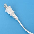 White Plug on a Vibrant Background Royalty Free Stock Photo