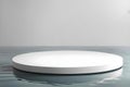 White podium with a round shape, set on the reflective water surface Royalty Free Stock Photo
