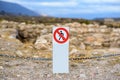 White pole with a sign prohibiting pedestrians from passing Royalty Free Stock Photo