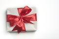 White polka dot gift box with red cute bow. Isolate background with copy space Royalty Free Stock Photo